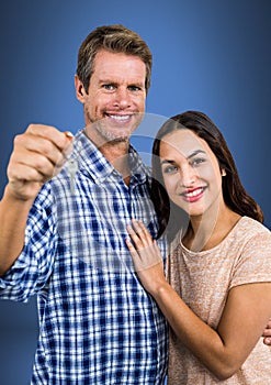 Couple Holding key in front of vignette