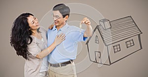 Couple Holding key with house drawing in front of vignette