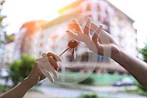 Couple holding the keys to his apartment