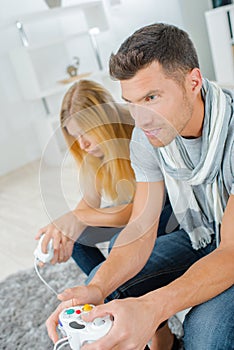 Couple at home playing computer game