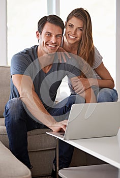 Couple, home and portrait with laptop, bonding and entertainment in living room with smile and laugh. Man, woman and