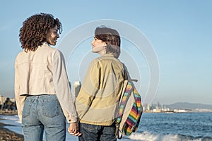 Couple of homosexual women in love holding hands