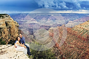 A couple on a honeymoon road trip at Grand Canyon
