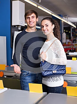 Couple at household appliances section