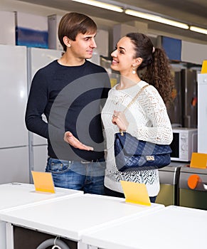 Couple at household appliances section