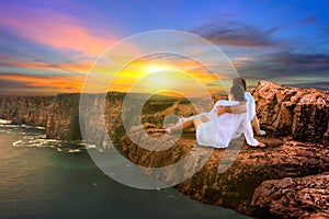 Couple in hug watching sunset