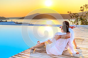 Couple in hug watching together sunrise