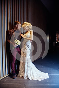 Couple hugged and kissed after the marriage. The bride and groom hug each other and look into their eyes. Love, tenderness,