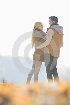 Couple hugging during autumn in park