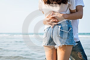 Couple is hugging on the beach. Romantic couple on the beach