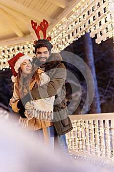 Couple hugging at Christmas market