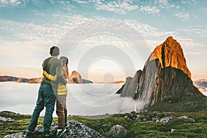 Couple hugging enjoying mountains landscape family traveling together