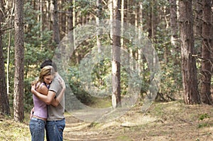 Couple Hugging In Forest