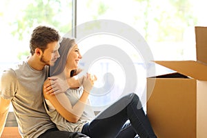 Couple hugging moving new house