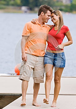 Couple hugging on pier