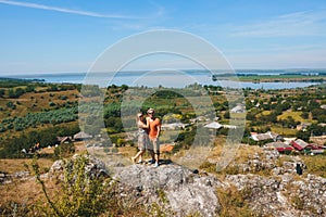 Couple hugging on top of hill