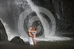 Couple Hugging Under Waterfalls