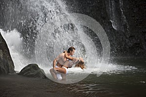 Couple Hugging Under Waterfalls