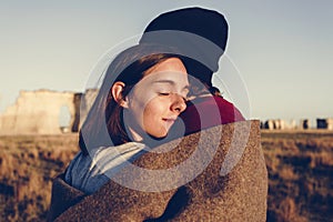 Couple hugging in the wilderness