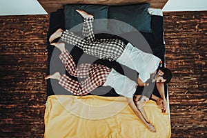 Couple is Imitating Divers in Water on Bed