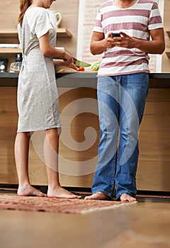 Couple, influencers and phone in kitchen for online research, ebook and nutrition in house. Man, woman and smartphone in