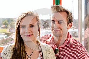 Couple inside a Ferris wheel on Oktoberfest