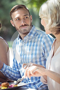 Couple interacting with each other while having meal