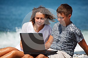 Couple with interest in looking at laptop