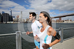 Couple of joggers by hudson river photo