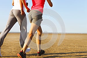 Couple jogging outside. Close up