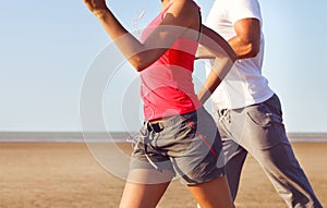 Couple jogging outside. Close up