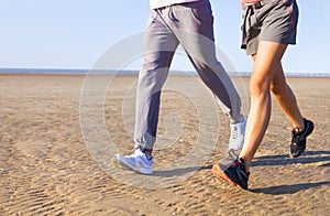 Couple jogging outside, runners training outdoors working out