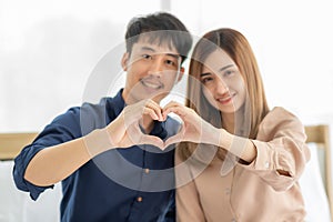 Couple join hand to be heart shape