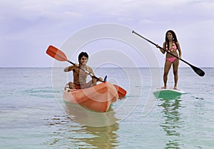 Couple with kayak and paddle board