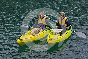 Couple Kayaking on a lake together