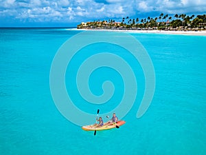 Couple Kayaking in the Ocean on Vacation Aruba Caribbean sea