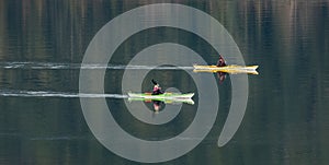 Couple kayaking together. Man and woman kayaking on lake together and smiling. Kayaking and canoeing with family