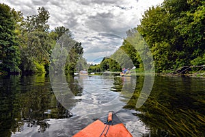 Couple kayaking together in mangrove river.