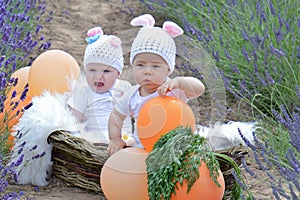 Couple of kids in bunny suit in basket