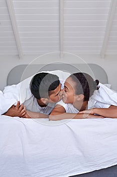 Couple kiss bedroom