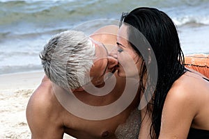 Couple kissing on the beach