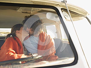 Couple Kissing In Campervan