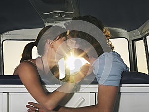 Couple Kissing In Campervan photo