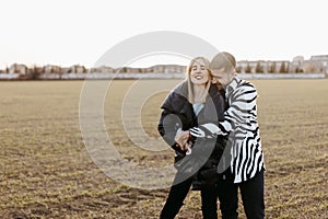 Couple kissing in the countryside embraced. Boyfriend and girlfriend in love