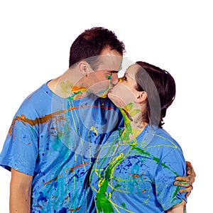 Couple kissing after having a paint fight