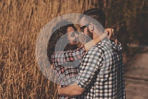 Couple kissing at lake docks