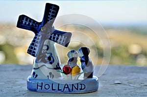 Couple kissing in the Netherlands ceramic windmill photo