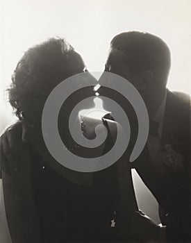 Couple kissing in silhouette