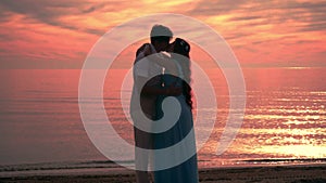 Couple kissing at sunset. Couple beach sunset. Kissing silhouette. Love couple