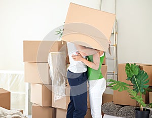 Couple kissing under the box